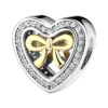 Charm en forme de cœur en argent avec nœud doré et pavage de zircons blancs