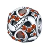 Charm mois de janvier en argent et zircon rouge foncé.