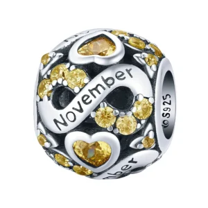 Charm mois de novembre en argent et zircon jaune miel.