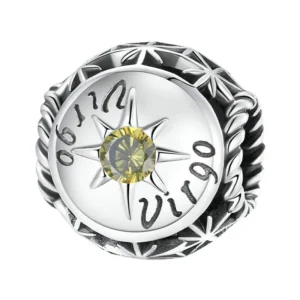 Charm Vierge en argent et pierre jaune lumineuse.